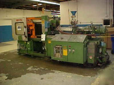 200 ton, 10.5 oz. reed injection molding machine'81