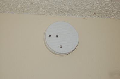 Smoke alarm cover/guard; prevent fire code violations